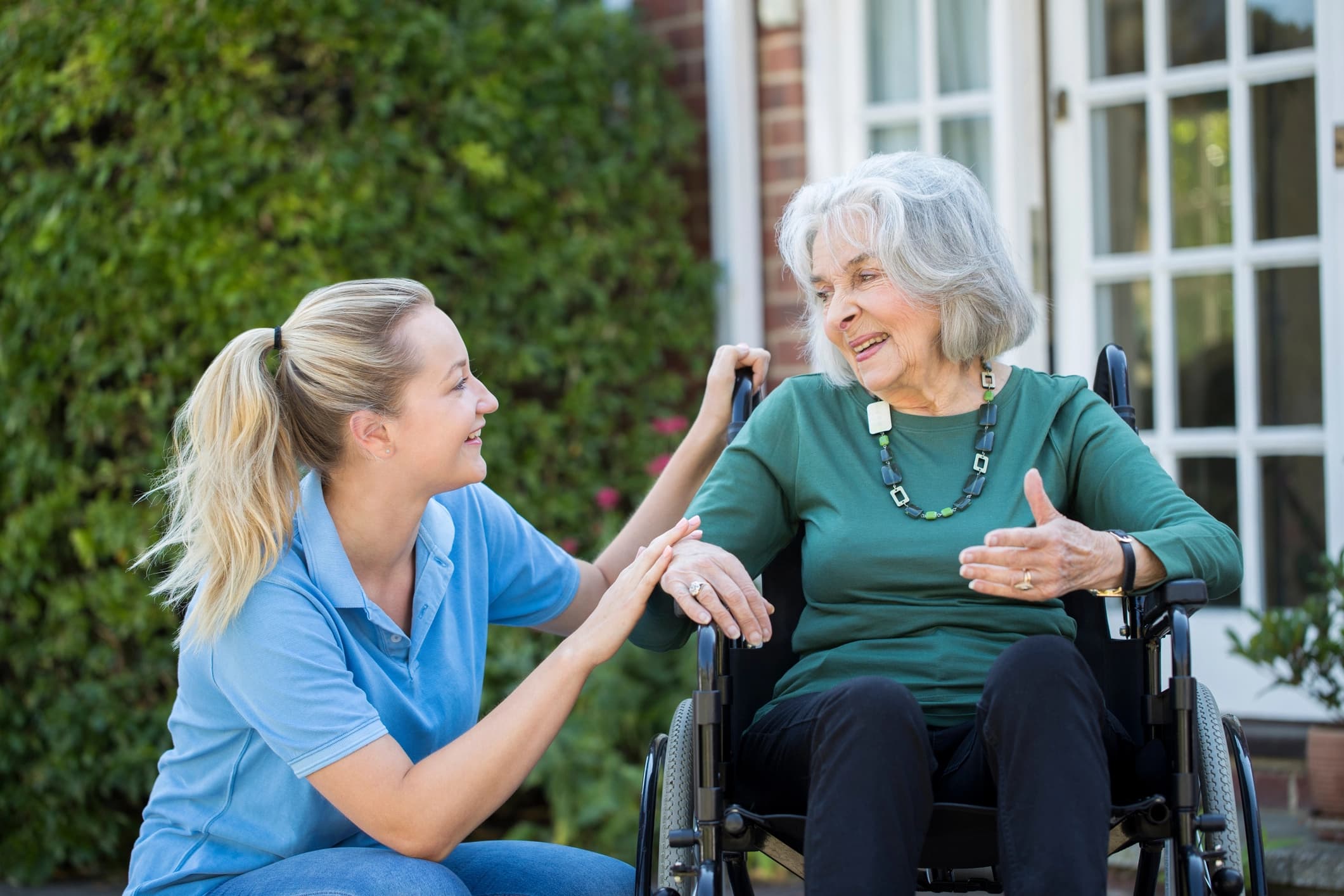 Support worker with client in a supported living environment